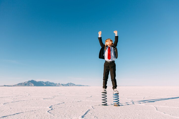 Person stood on springs on a salt flat