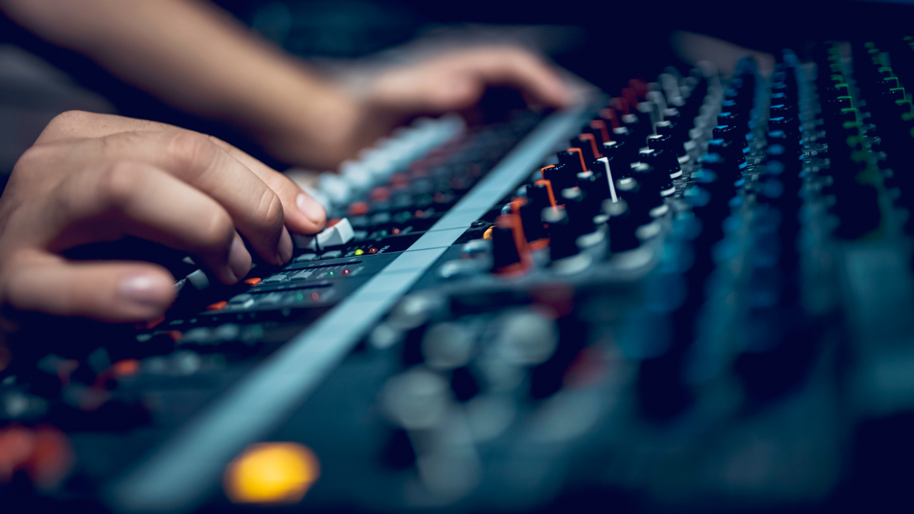 Man using sound mixing station