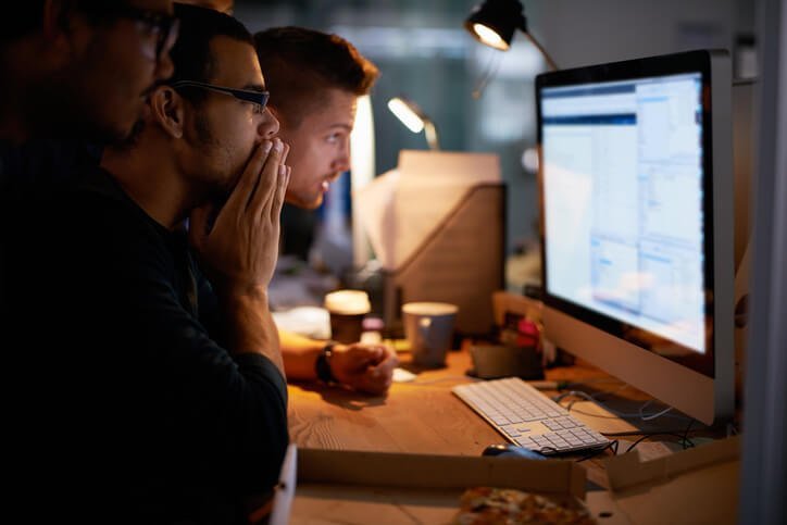 A group of people working at a computer