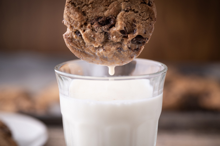 Cookie dipped into milk representing Google Analytics cookies no longer being used